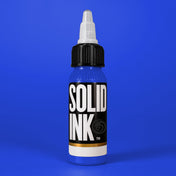Solid Ink Boca Blue tattoo ink 2 oz bottle on coloured background