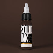 Solid Ink Chocolate tattoo ink 2 oz bottle on coloured background