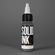 Solid Ink Cool Grey tattoo ink 2 oz bottle on coloured background