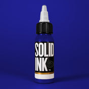 Solid Ink Dark Blue tattoo ink 2 oz bottle on coloured background