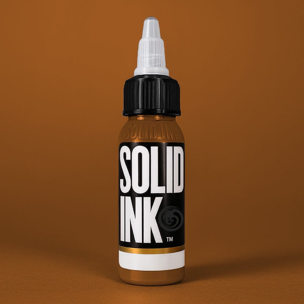 Solid Ink Dulce De Leche tattoo ink 2 oz bottle on coloured background
