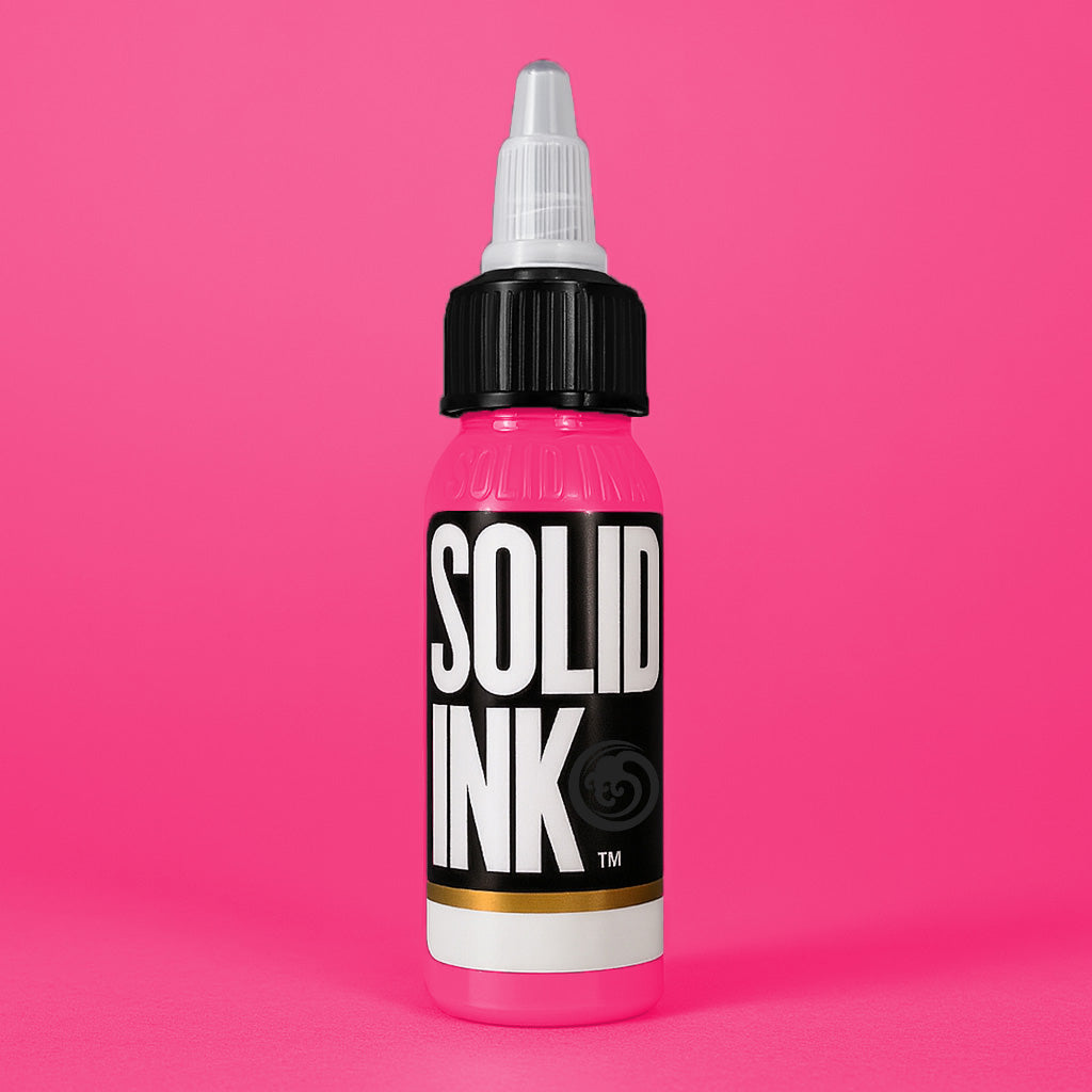 Solid Ink Fuchsia tattoo ink 2 oz bottle on coloured background