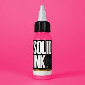 Solid Ink Fuchsia tattoo ink 2 oz bottle on coloured background