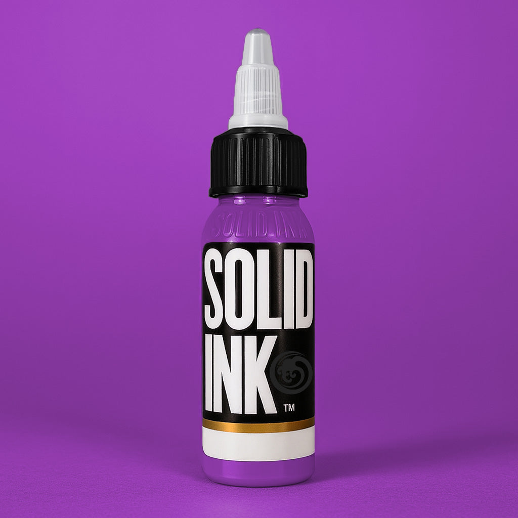 Solid Ink Grape tattoo ink 2 oz bottle on coloured background