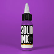 Solid Ink Grape tattoo ink 2 oz bottle on coloured background