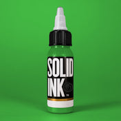 Solid Ink Light Green tattoo ink 2 oz bottle on coloured background