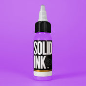 Solid Ink Lilac tattoo ink 2 oz bottle on coloured background