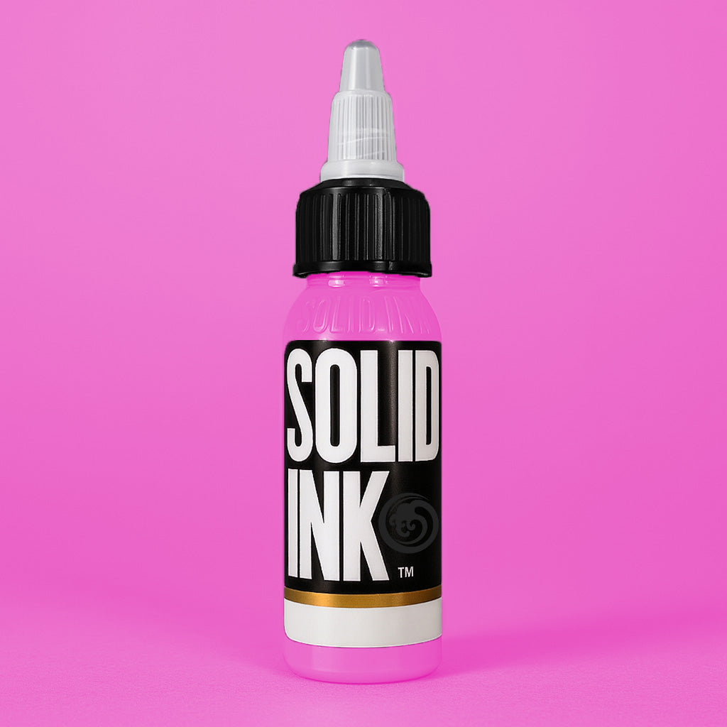 Solid Ink Lollipop tattoo ink 2 oz bottle on coloured background