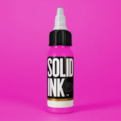 Solid Ink Magenta tattoo ink 2 oz bottle on coloured background