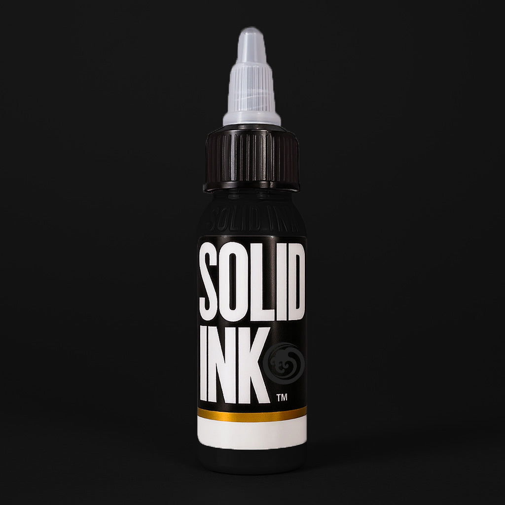 Solid Ink Matte Black tattoo ink 2 oz bottle on black background