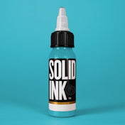 Solid Ink Miami Blue tattoo ink 2 oz bottle on coloured background