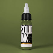 Solid Ink Mold tattoo ink 2 oz bottle on coloured background