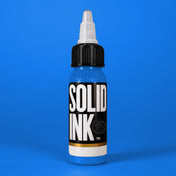 Solid Ink Nice Blue tattoo ink 2 oz bottle on coloured background