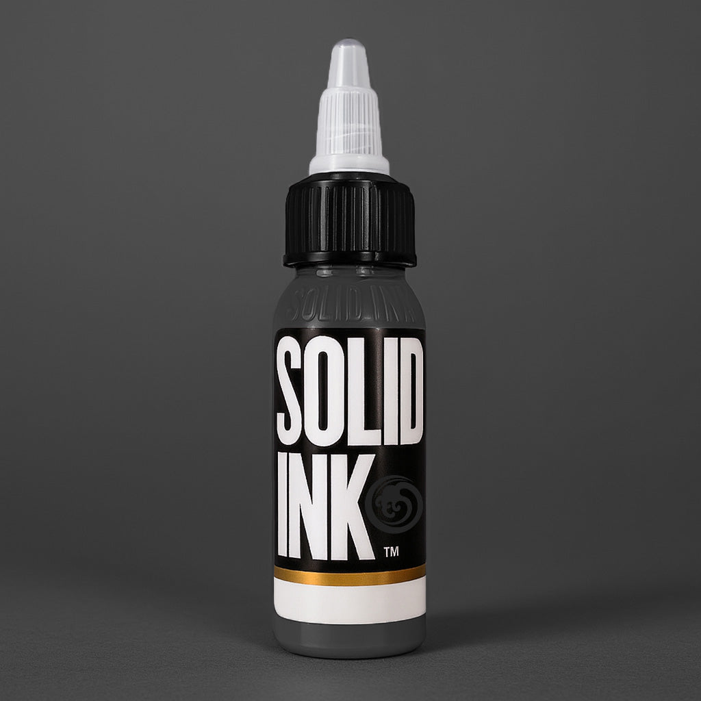 Solid Ink Onyx tattoo ink 2 oz bottle on coloured background