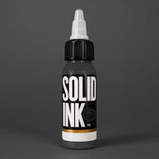 Solid Ink Onyx tattoo ink 2 oz bottle on coloured background