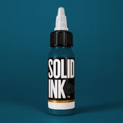 Solid Ink Petroleum tattoo ink 2 oz bottle on coloured background