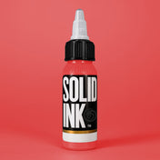 Solid Ink Rose tattoo ink 2 oz bottle on coloured background