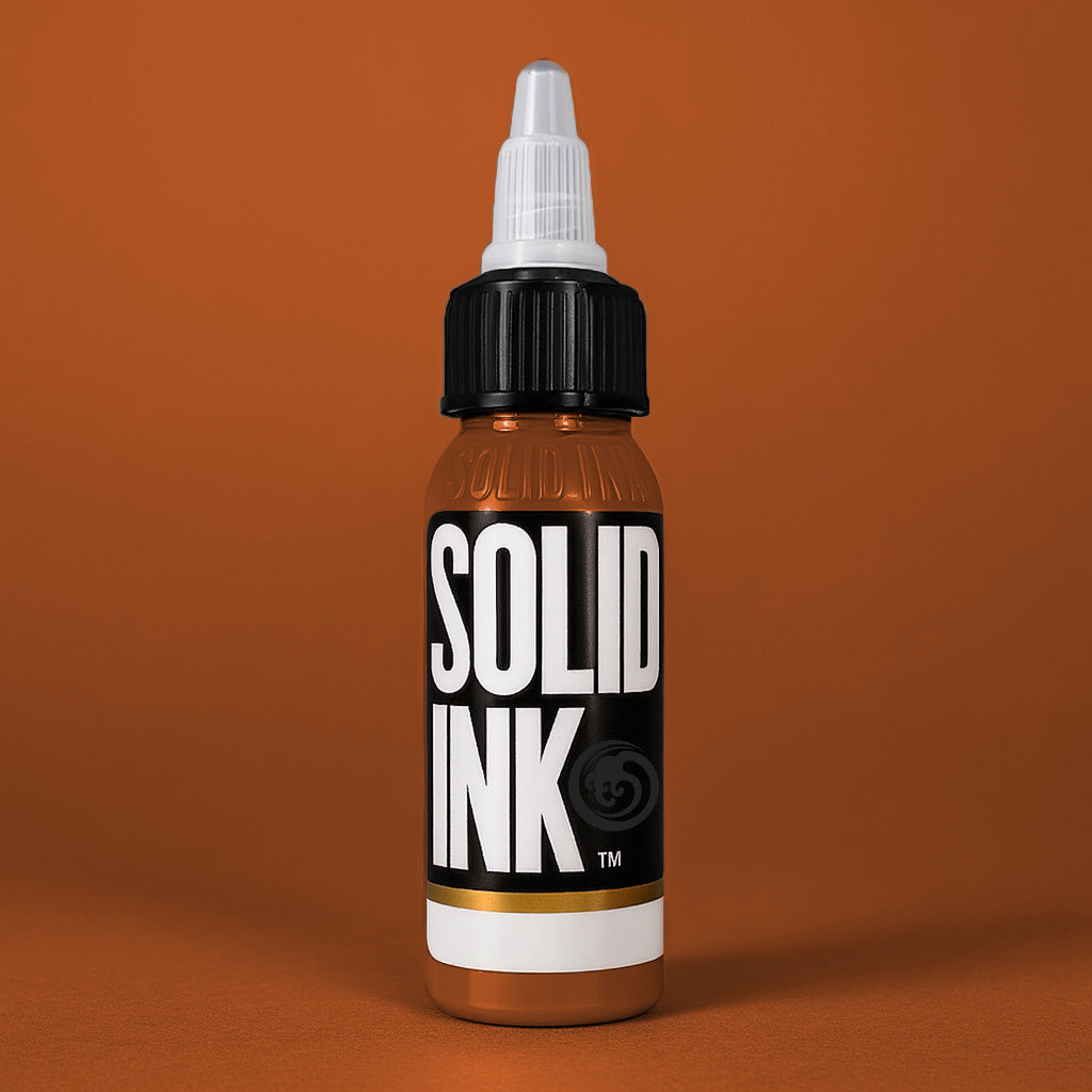 Solid Ink Tiger tattoo ink 2 oz bottle on coloured background