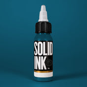 Solid Ink Turquoise tattoo ink 2 oz bottle on coloured background