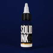 Solid Ink Ultramarine tattoo ink 2 oz bottle on coloured background