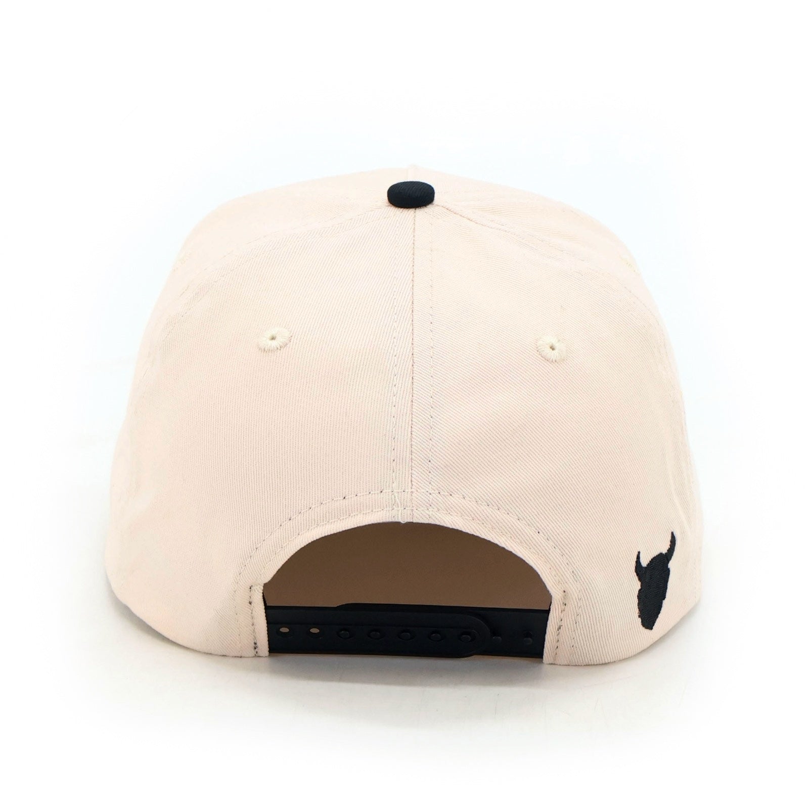 Back of the beige Demons snapback showing the snap closure and demon head